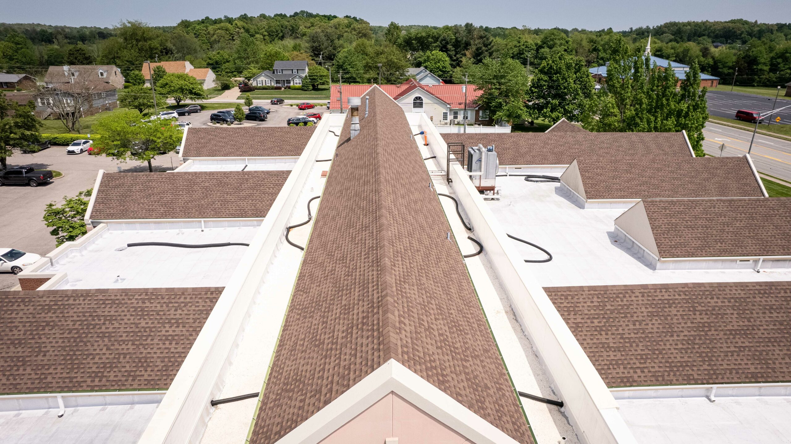 Aerial view of roofing work showcasing shingles and waterproofing, executed by Eskola Roofing.
